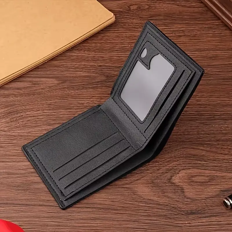 Open black men's bifold wallet with card slots and transparent ID window